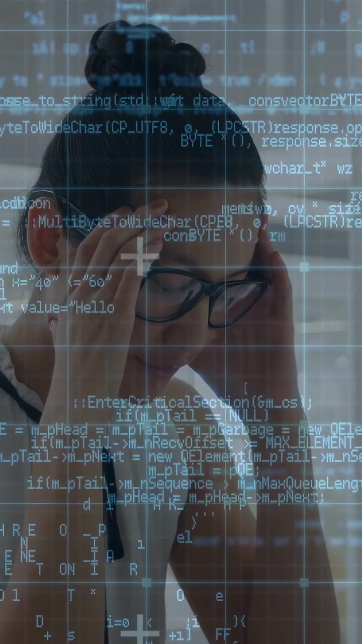 Vertical video: Woman reading tech code, rubbing head from bug, adjusting glasses as grid overlays