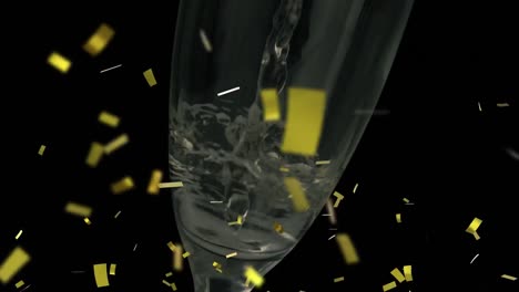 animation of falling confetti over glass of champagne on dark background