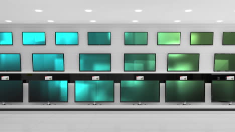 interior of electronics store with synchronized video playing on screens of multiple televisions