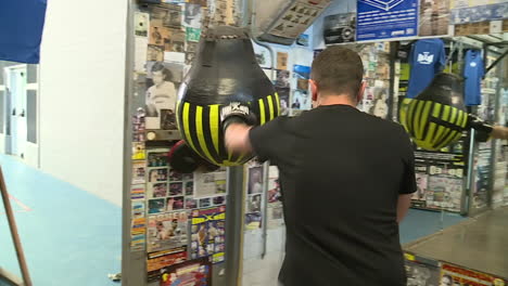 man training with punching bag