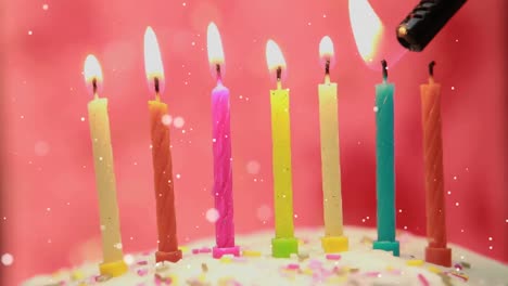 Animation-of-dots-flying-over-lighter-and-birthday-candles