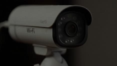 a home security camera is being installed in an urban area to enhance safety and monitor the surroundings. the device is adjusted for optimal viewing and functionality.
