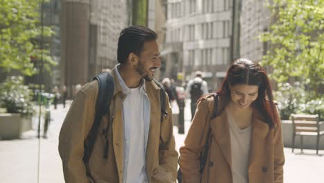 Muslim-Couple-On-Date-Talking-As-They-Walk-Along-City-Street-Together