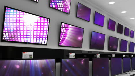 interior of electronics store with synchronized video playing on screens of multiple televisions