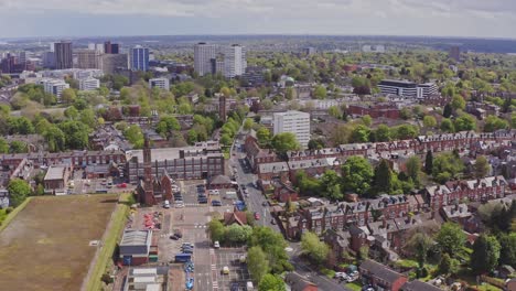 aerial drone shot over top of suburban british housing estate in birmingham, england