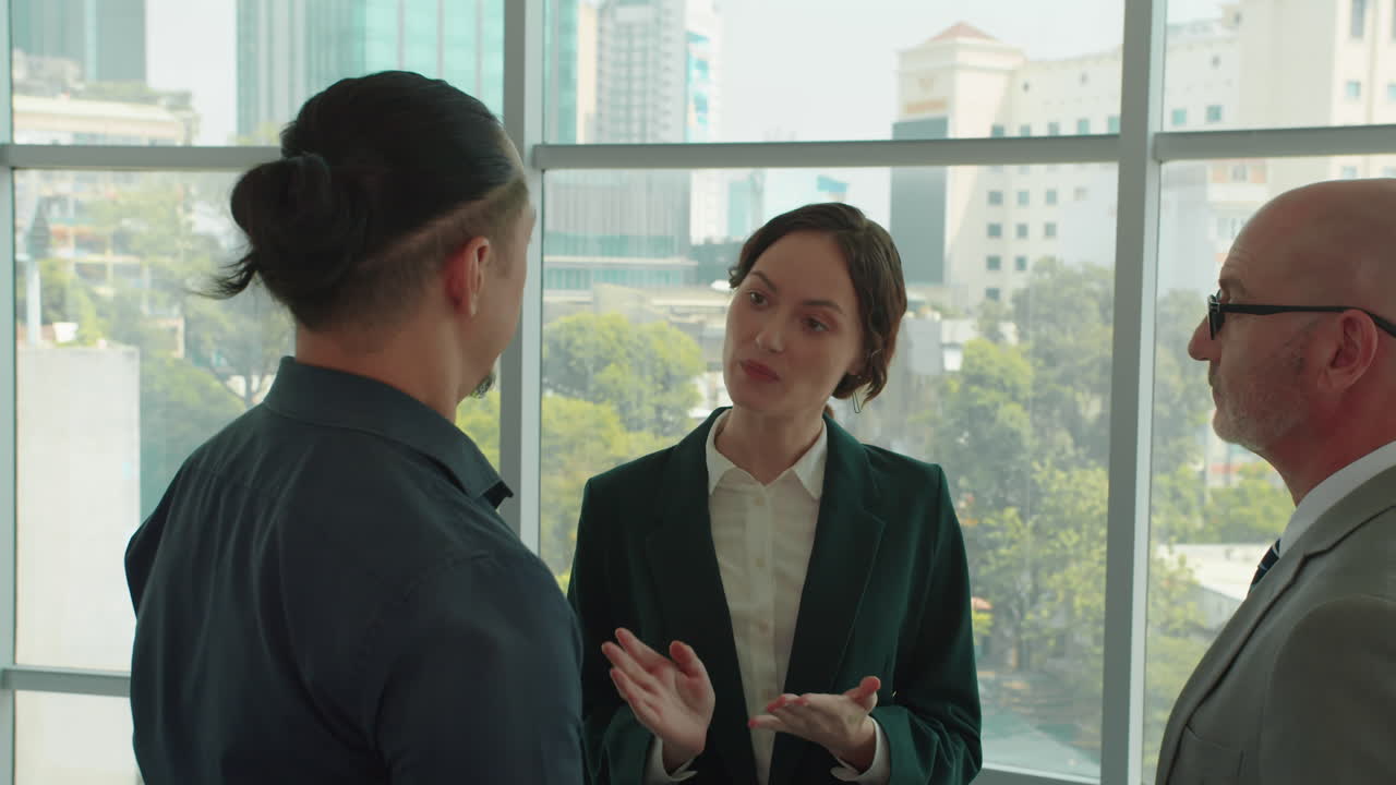 Female Manager Explaining Project Tasks to Male Employees