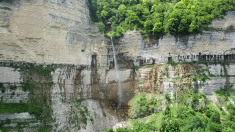 majestic okatse falls cascading down limestone cliffs in imereti, georgia