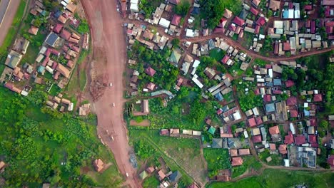 kampala-entebbe expressway, uganda, east africa - cars traveling along the bustling highway near a residential community - bird's eye view