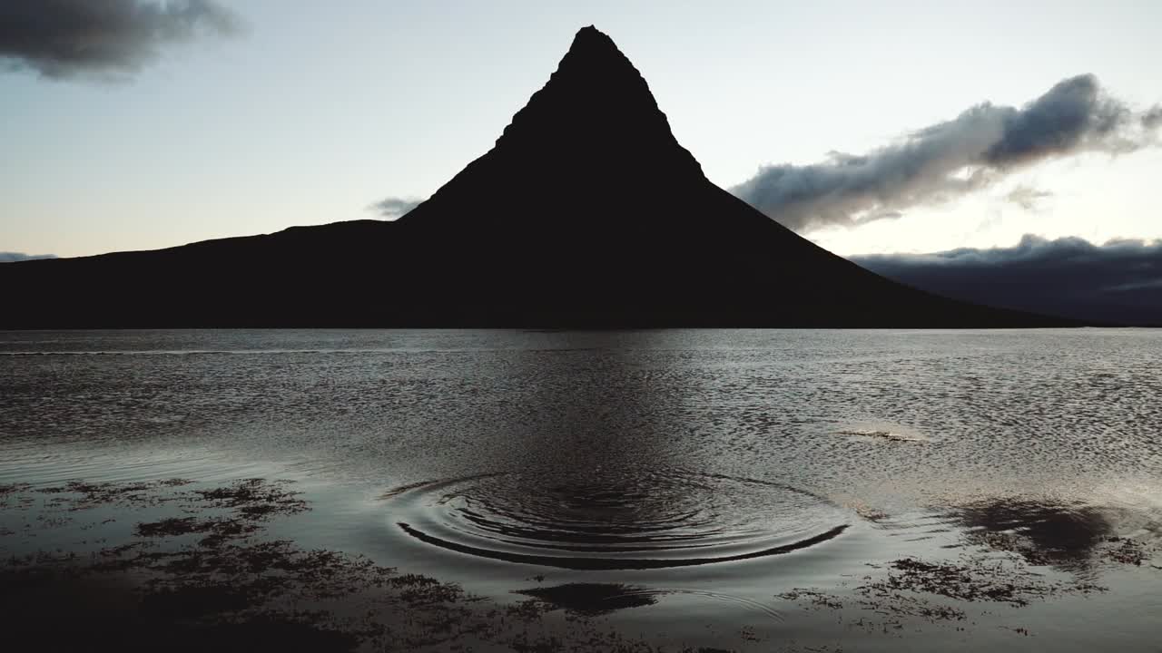 Slow motion video, 4 am in front of the famous Kirkjufell, in Iceland.