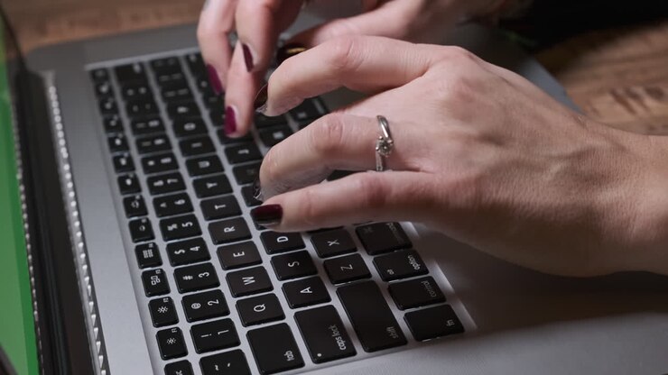Woman Hands Typing on Keyboard Laptop