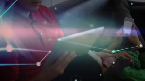 network of connections against mother and daughter using electronic devices at home
