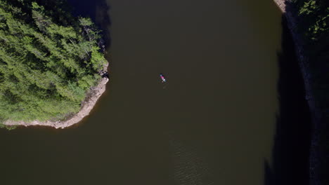 kayaking on a mountain lake, top view with boat tracking