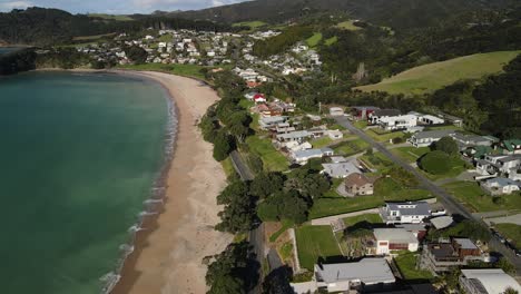 aerial view of small settlement beside sandy beach