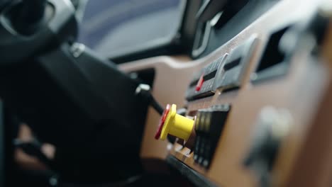 close-up-and-zooming-on-parking-brakes-nobs-of-a-new-semi-truck-freightliner-cascadia-volvo-2023,-Shallow-depth-of-field