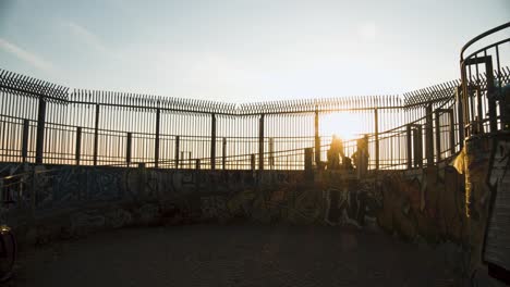 orange sunbeams on historic flak tower of berlin during summer sunset