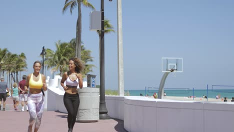 content women jogging in tropical sunshine