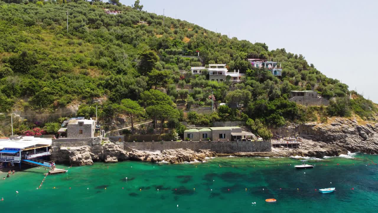 Aerial drone view of beautiful beach of Punta Campanella in Campania, Italy with turquoise sea water on a sunny day