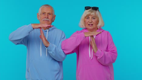 tired senior old grandfather grandmother showing time out gesture, limit or stop sign, no pressure