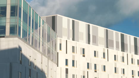 Modern-hospital-in-Helsinki-city-with-moving-clouds-on-blue-sky