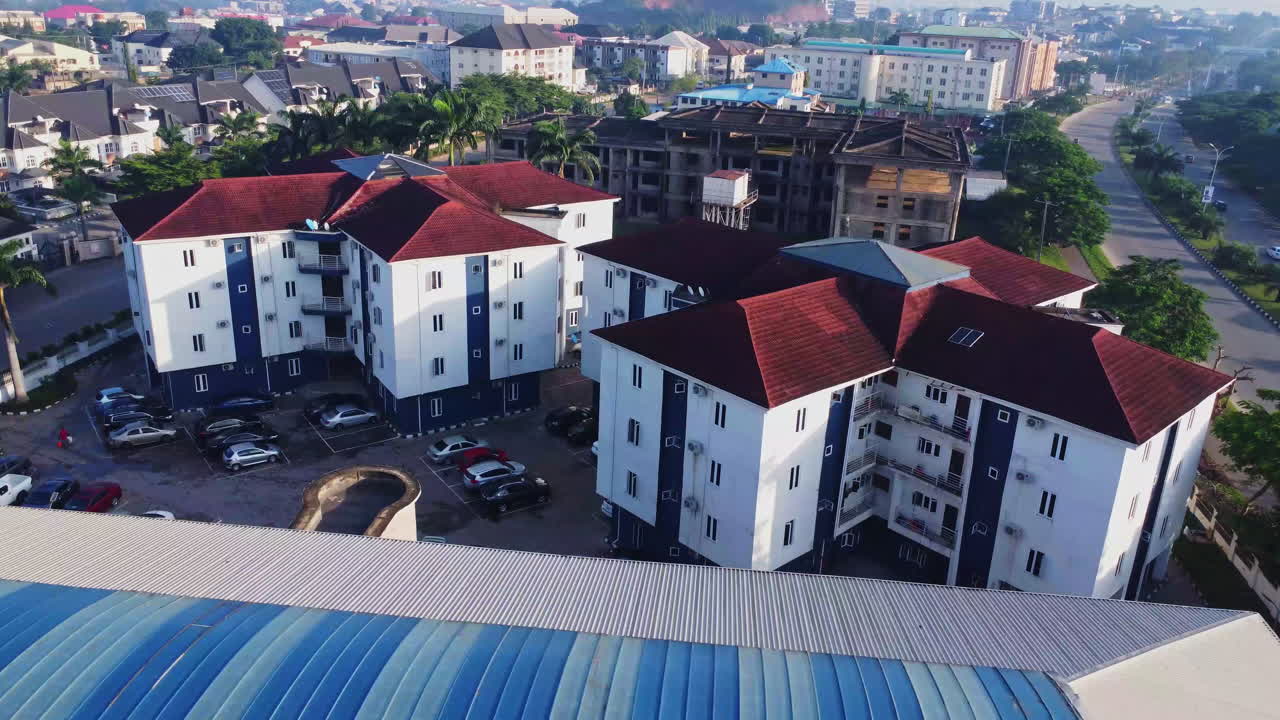 Static high angle view of newly built apartment buildings in the city of Abuja, Nigeria on a sunny day in Africa