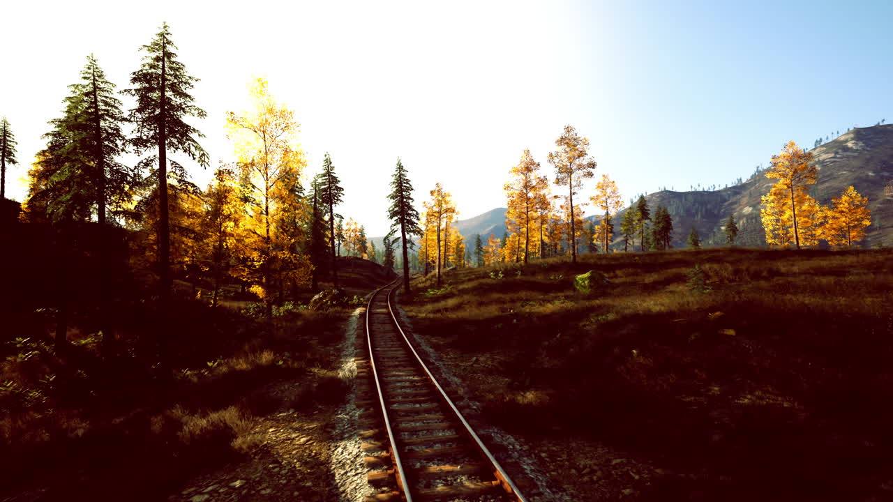 Colorful train track extending toward mountain sunrise scene