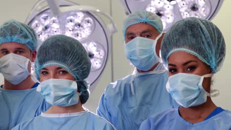 surgical team looking at the camera in operating theater