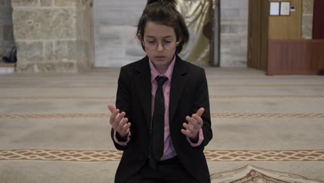 child praying with hands