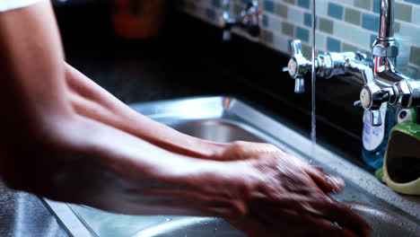 close-up of senior man washing hands