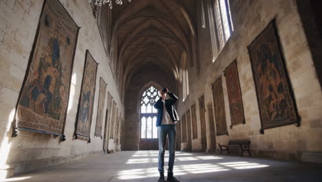 photographer capturing the grand architecture of a historic hall