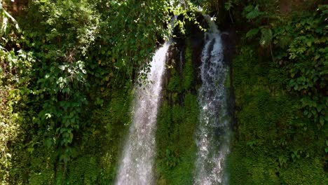 togonan falls in lush jungle near mainit in the philippines