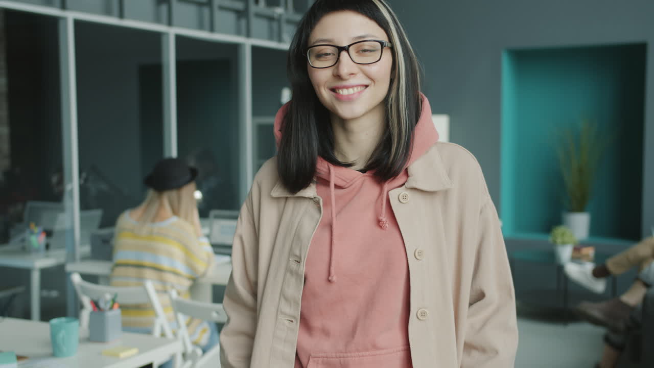 Smiling woman in a modern office
