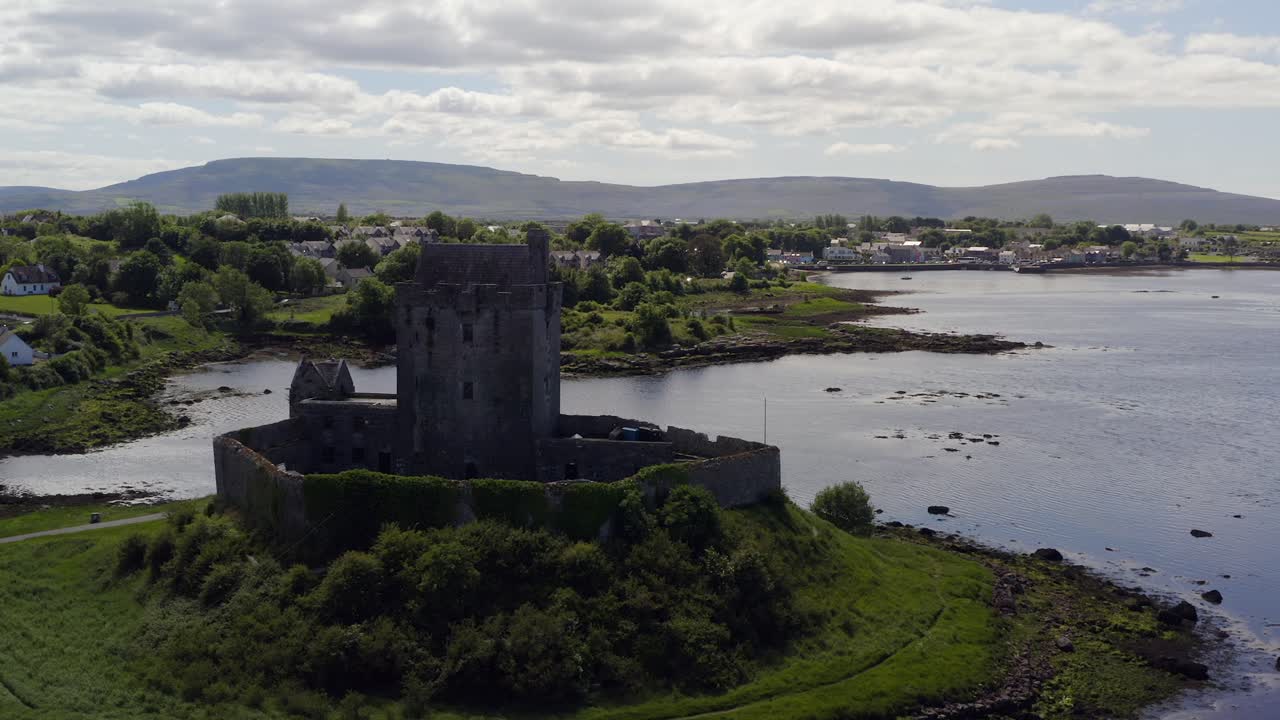 Calm orbiting shot of Dunguaire Castle