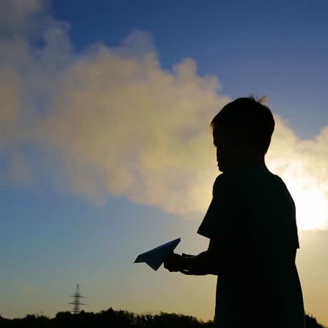 kid playing with plane