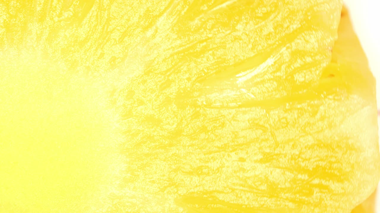 위쪽 보기 회전 슬라이스 신선한 파인애플 클로즈업, 노란 파인애폴 링 텍스처.