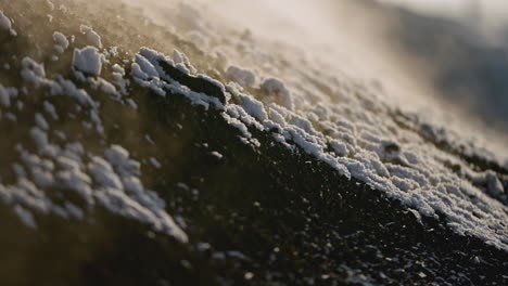 snow and steam on dark ground