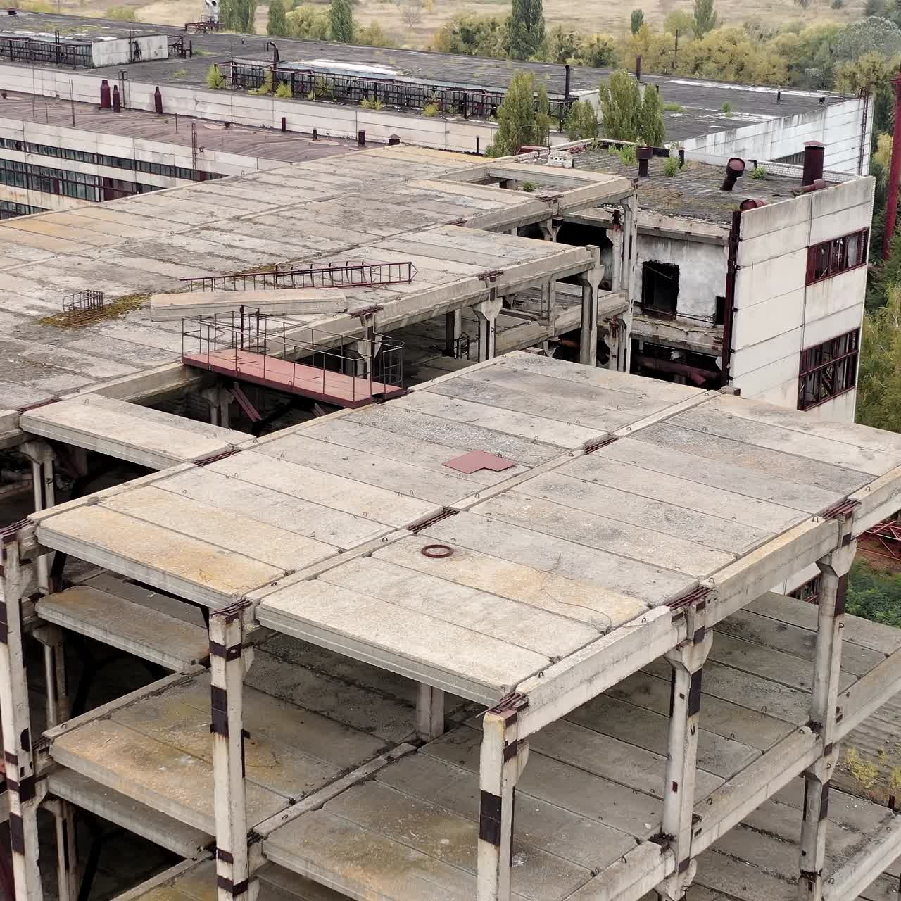 Ruined buildings. Industrial constructions without windows on abandoned plant. Old manufacture. Circling view
