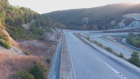 Castelloli-speed-circuit-in-barcelona-during-early-evening-with-sparse-traffic,-aerial-view