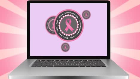 Animation-of-pink-ribbon-logo-and-breast-cancer-text-on-laptop-screen