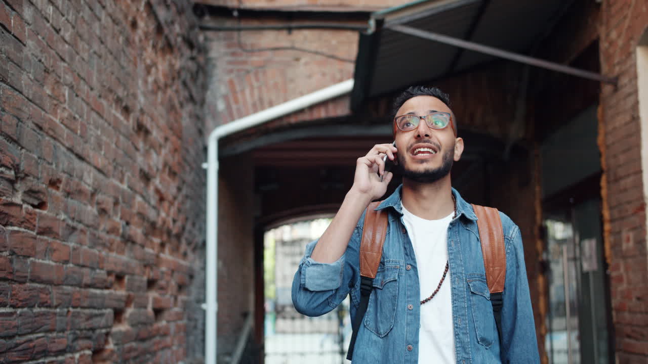 Young Man on the Phone in a City Alley