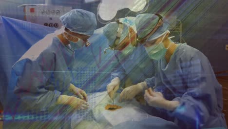 Animation-of-life-line-over-caucasian-surgeons-in-operating-theatre