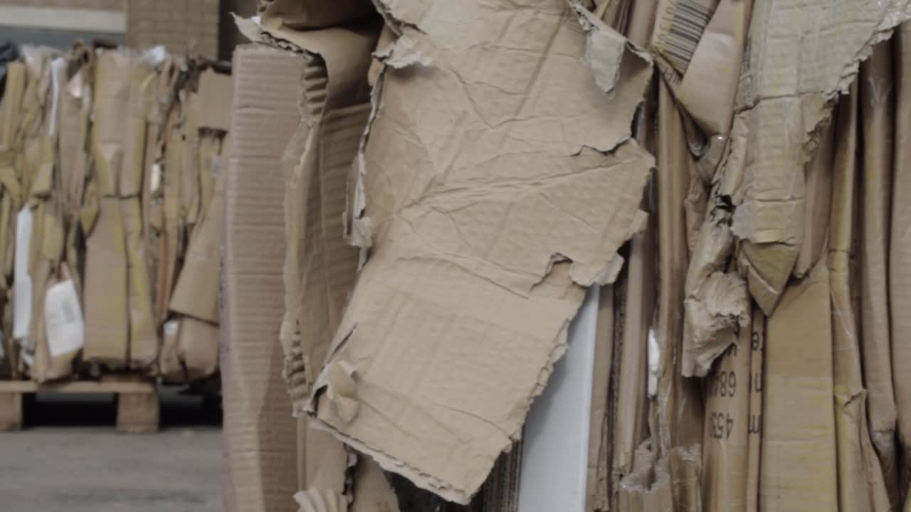 Cardboard box waste in yard panning shot