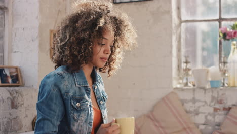 young student drinking coffee at home in the morning