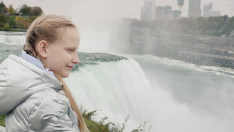 girl admires the spectacular panorama at niagara falls