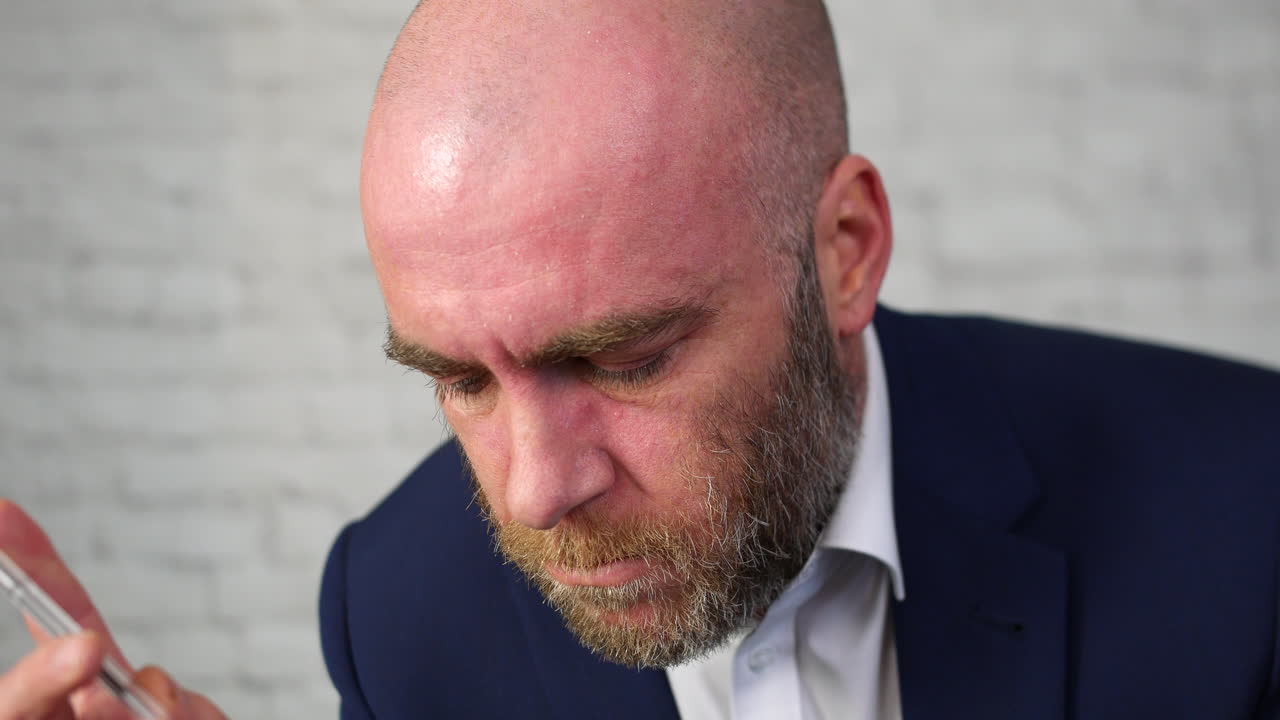 A business man working on a project and thinking of a solution to a problem