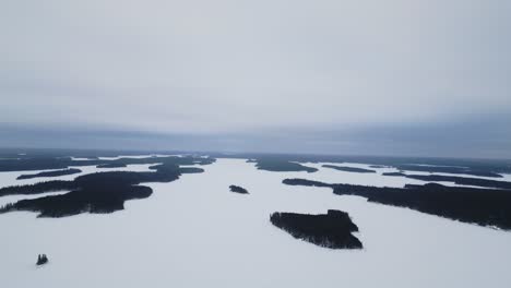 Establishing-Drone-Shot-of-Paint-Lake-Provincial-Park-Frozen-Islands-Northern-Manitoba-Canada