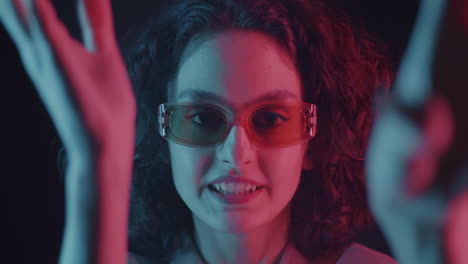 Woman with Neon Light and Sunglasses