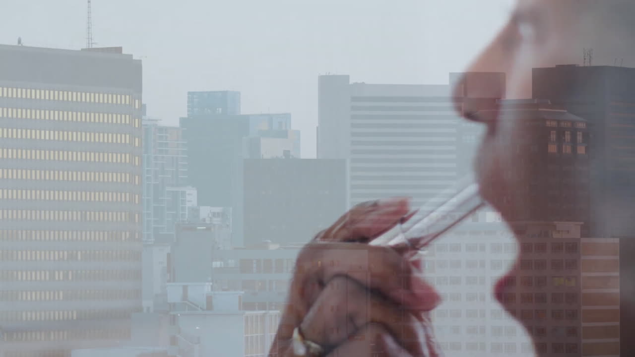Animation of senior african american woman doing make up over cityscape