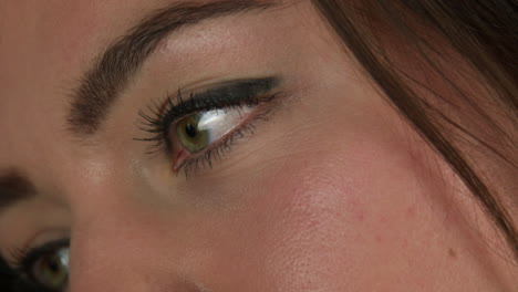 close-up of a young female's face, spontaneously smiling