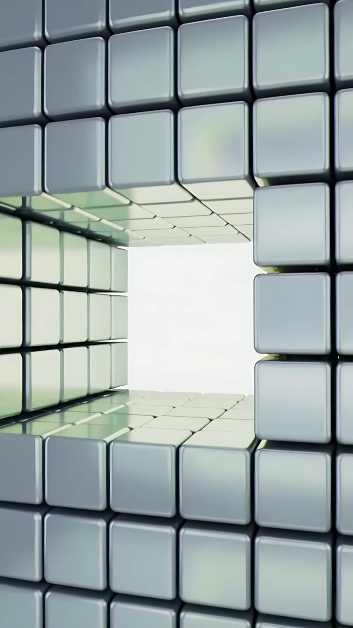 Video verticale: La telecamera si muove attraverso un portale di cubi lucidi impilati, rivelando giunture verdi.