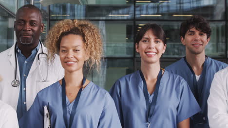 portrait of medical team standing in modern hospital building